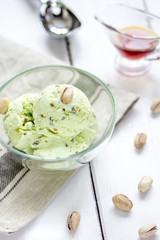 organic homemade ice cream in glass bowl on wooden background