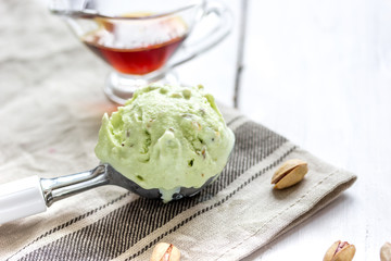 organic homemade ice cream in glass bowl on wooden background