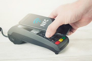 Mobile payment with smart phone. payment nfc near field communication phone credit card concept