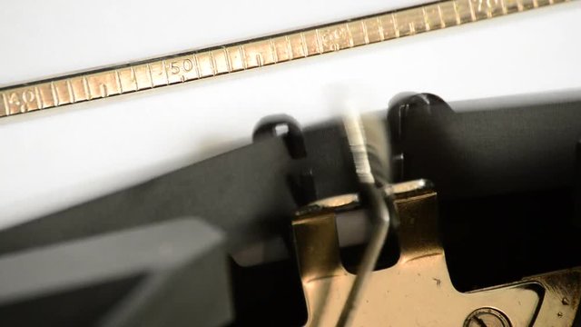 Typing the expression Dear Friend with an old manual typewriter
