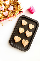 cookies for Valentine Day heartshaped on white background top view