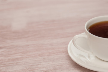 Half Cup of tea on a old wooden background