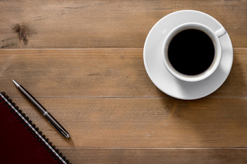 Obraz na płótnie Canvas Hot cup of Americano coffee morning breakfast with dark red note