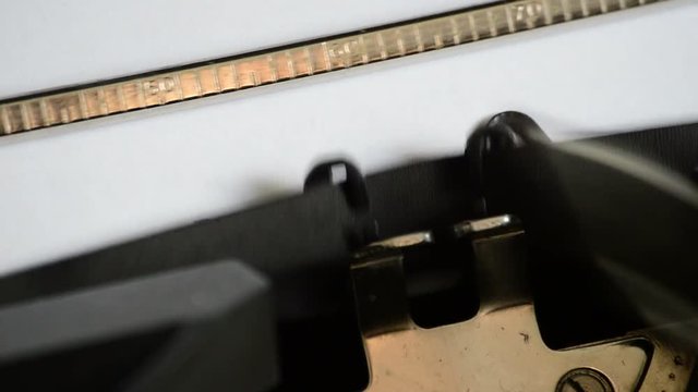 Typing the expression Dear Diary with an old manual typewriter