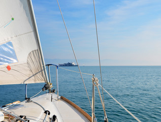 Obraz premium Sailing on Lake Constance on a calm sunny day with passenger boat in background