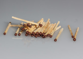 wooden matches on a gray background