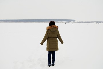 a woman on a winter lake
