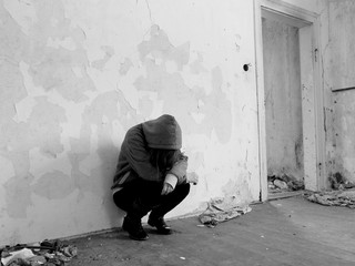 Sitting women in depression, young sadness women crying in old dirty abandoned house