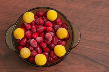 dish with frozen cherry plum and dogwood