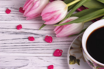 Valentine's day elegant still life with tulip flowers cup of coffe marshmallow red heart shape sign