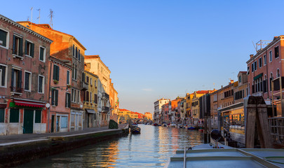 Fototapeta na wymiar Venice, Italy - September 2, 2016. Morning in Venice reflected in canal waters