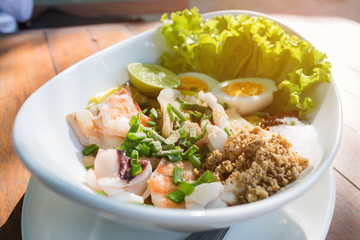 Top view spicy seafood Salad ingredient with squid shrimp fish and egg.