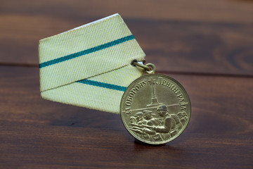 Rare soviet military awards on vintage background. Leningrad defense