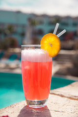summer cocktail by pool. Delicious beverages