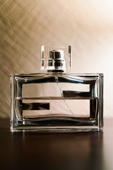 Men's perfume in a glass container.