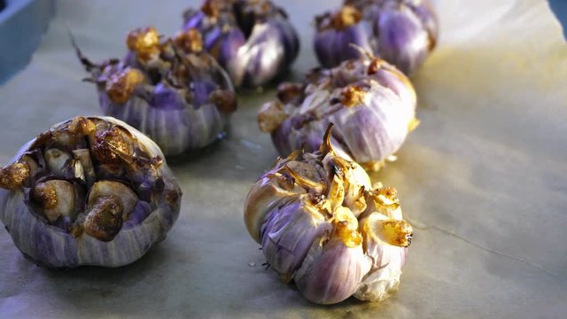roast garlic in the oven. Preparing French garlic soup. Vegetarian cuisine
