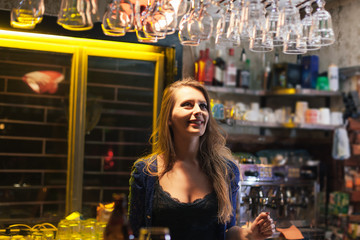 woman bartender enjoying her job