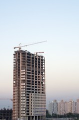 Fototapeta na wymiar Building Construction with Crane
