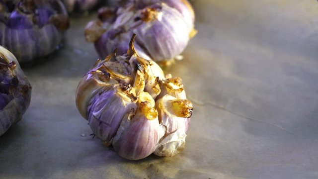 roast garlic in the oven. Preparing French garlic soup. Vegetarian cuisine
