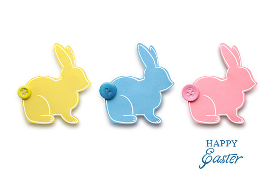Happy easter / Creative easter concept photo of three rabbits made of paper on white background.