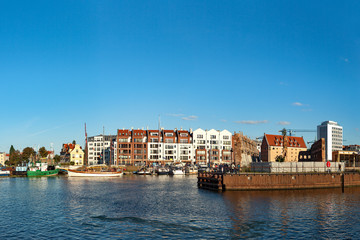 Fototapeta na wymiar View across the Motlawa River to the Granary Island in Gdansk, Poland.