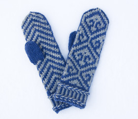 Knitted woolen mittens with ornament
