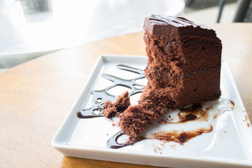 Piece of chocolate cake with warm chocolate syrup(soft focus)