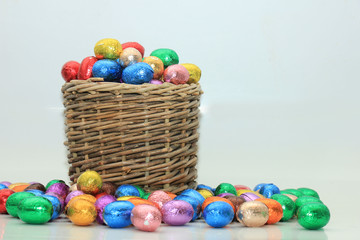Fototapeta na wymiar Easter eggs in a wicker basket