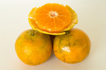 Ripe oranges isolated on white background. Orange in a cut
