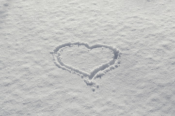 Romantic Valentines heart drawn on the snow love