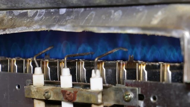 Ignition gas furnace closeup. Blue flame 4