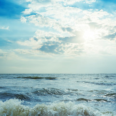 low dramatic clouds in sunset over sea