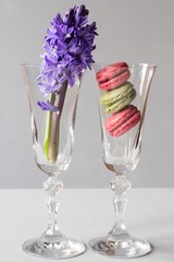 Glass with french macaroons and flowers