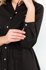 Details of women's clothing. Detail dress on a model on a white background