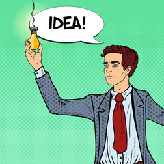 Pop Art Businessman with Lightbulb Idea. Vector illustration