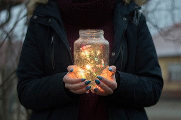 Light garland in a jar