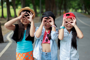 Three kid asian standing working posture a hand-made glasses