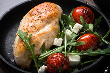 Grilled chiken fillet and fresh vegetables salad.