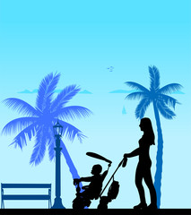Mother walking with her baby on a tricycle on the beach, one in the series of similar images silhouette