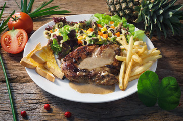 steak on table top viwe wooden background.