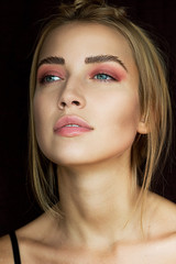 Obraz premium Beauty Portrait of Woman with Pink Eyeshadow and Natural Glow Skin Close Up