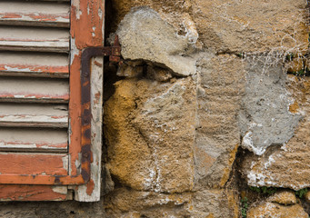Red window on a grungy wall