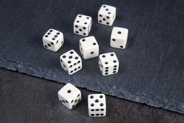 white dice on dark background