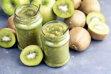 Fototapeta na wymiar Green detox smoothie with green apple and kiwi