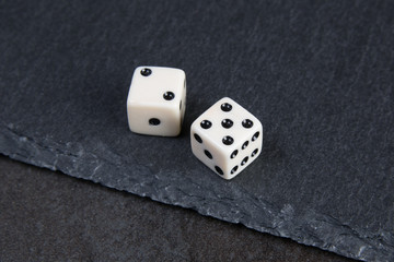 white dice on dark background