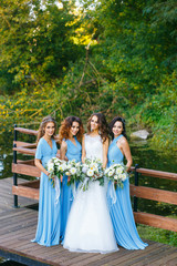 Obraz na płótnie Canvas Bride with bridesmaids