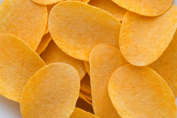 Close up potato chips on wood top view background.