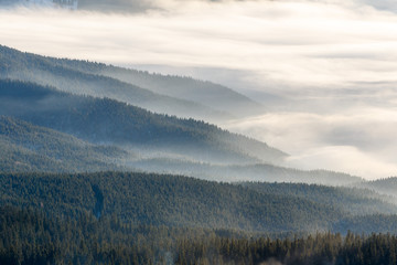 Fototapeta na wymiar misty mountains on ski resort