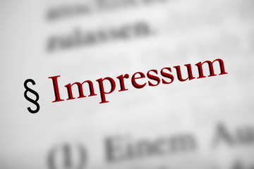 Fototapeta premium Impressum - rote Buchstaben, schwarz abgesetzt