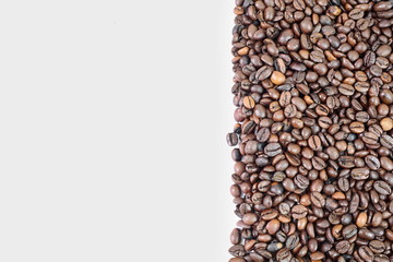 Coffee beans isolated on white background with copyspace for text. Coffee background or texture concept. 